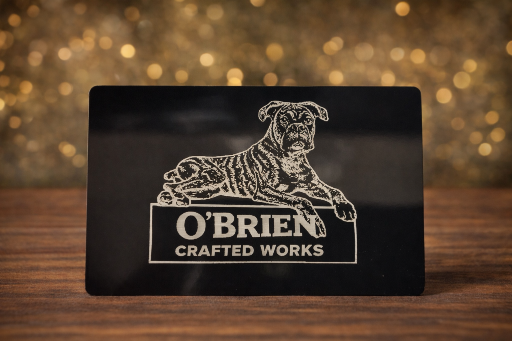 Aluminium Business Card Black engraved business card displaying "O'Brien Crafted Works" with a dog logo.